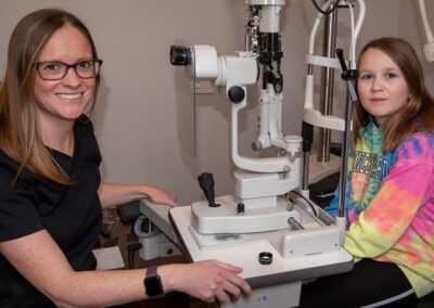 Dr. Angela Arsenault and patient at eye exam at In Focus Eye Care, Summerside PEI